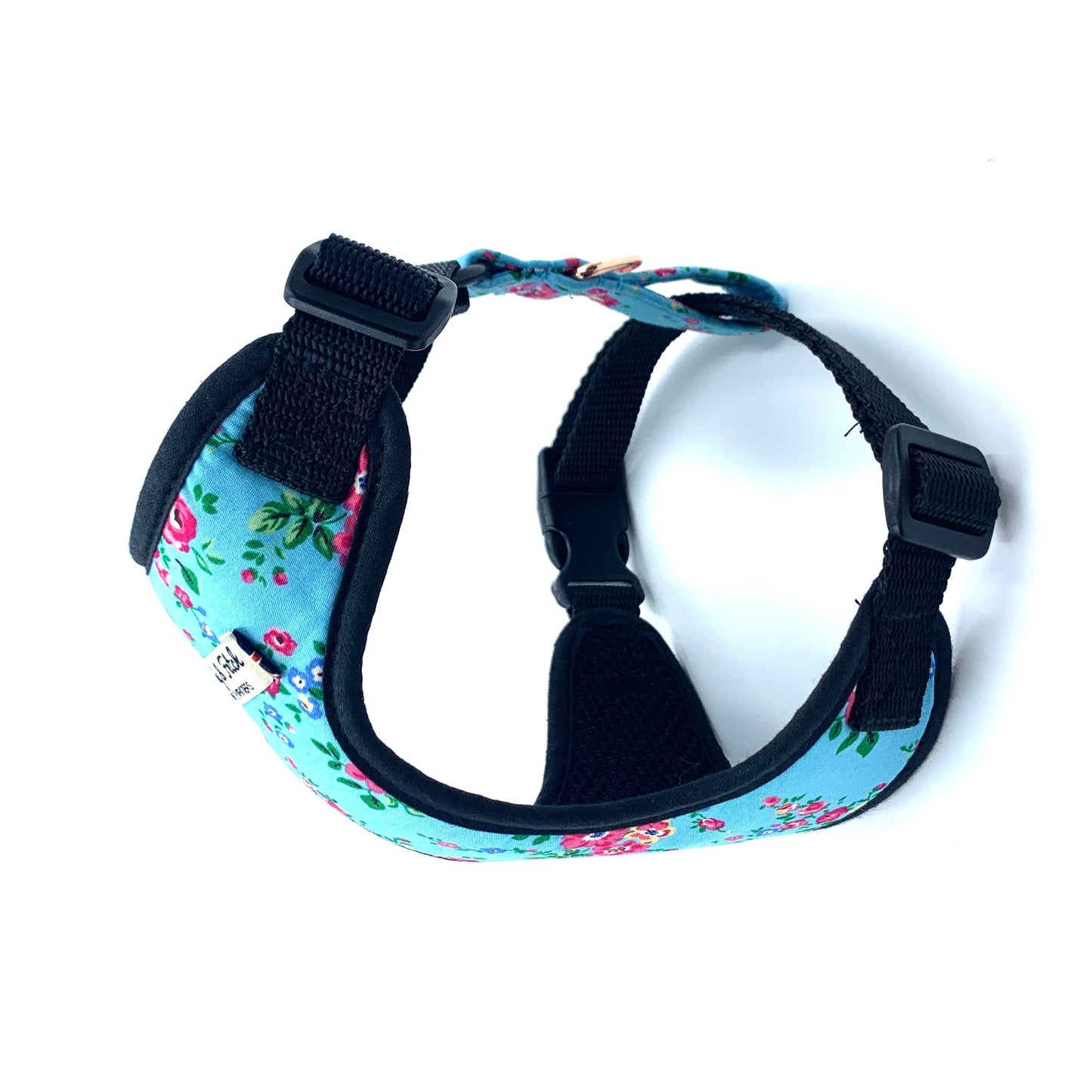 Floral-patterned dog harness on a white background