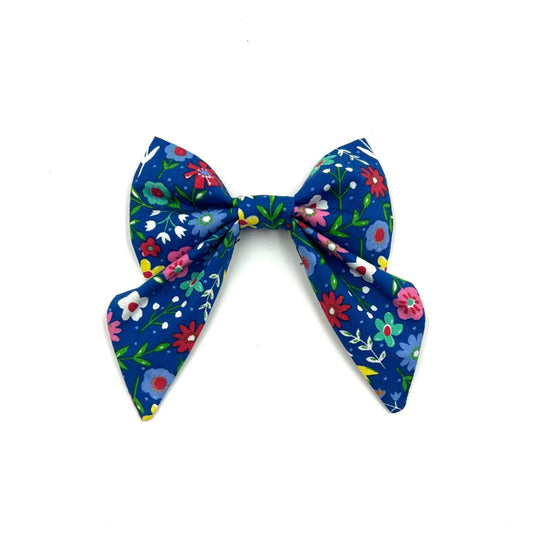 Beautiful handmade sailor bow in cobalt blue floral print fabric made to attach to a dog collar handmade by barkley and fetch uk