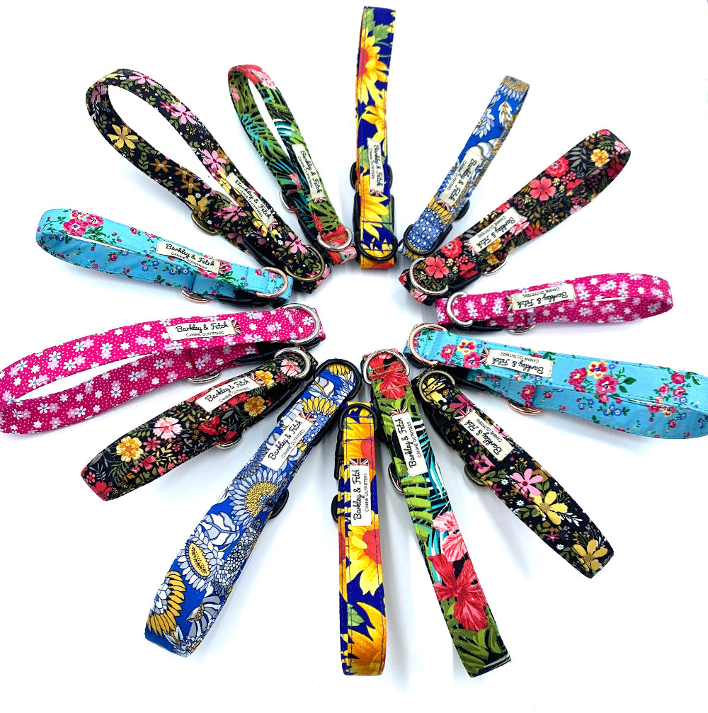 Floral handmade dog collars displayed in the shape of a flower on a white background