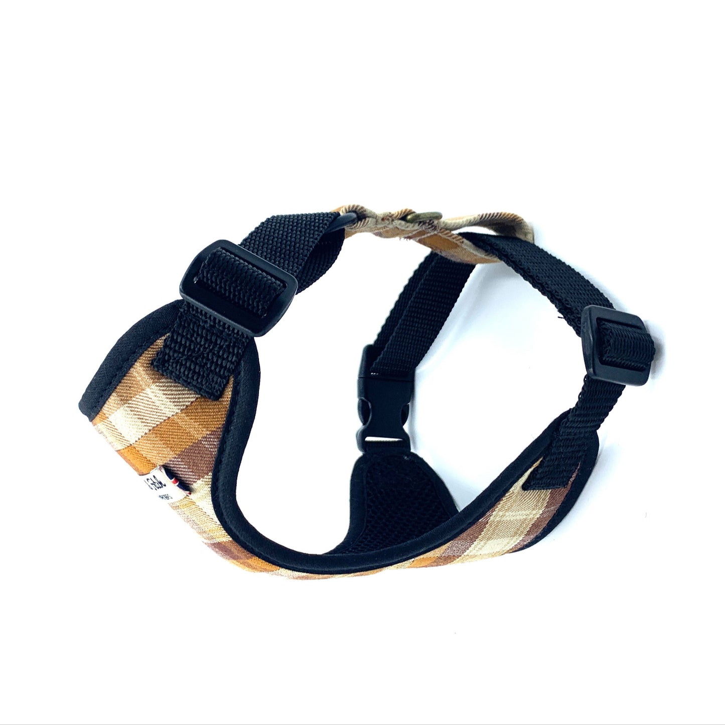 Dog harness with plaid pattern and black straps on a white background