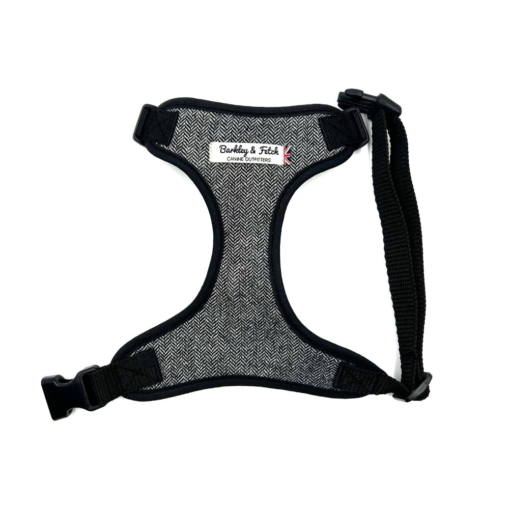A grey herringbone pattern dog harness with adjustable straps and a heavy-duty d-ring, displayed on a white background. Handmade in the UK by Barkley and Fetch