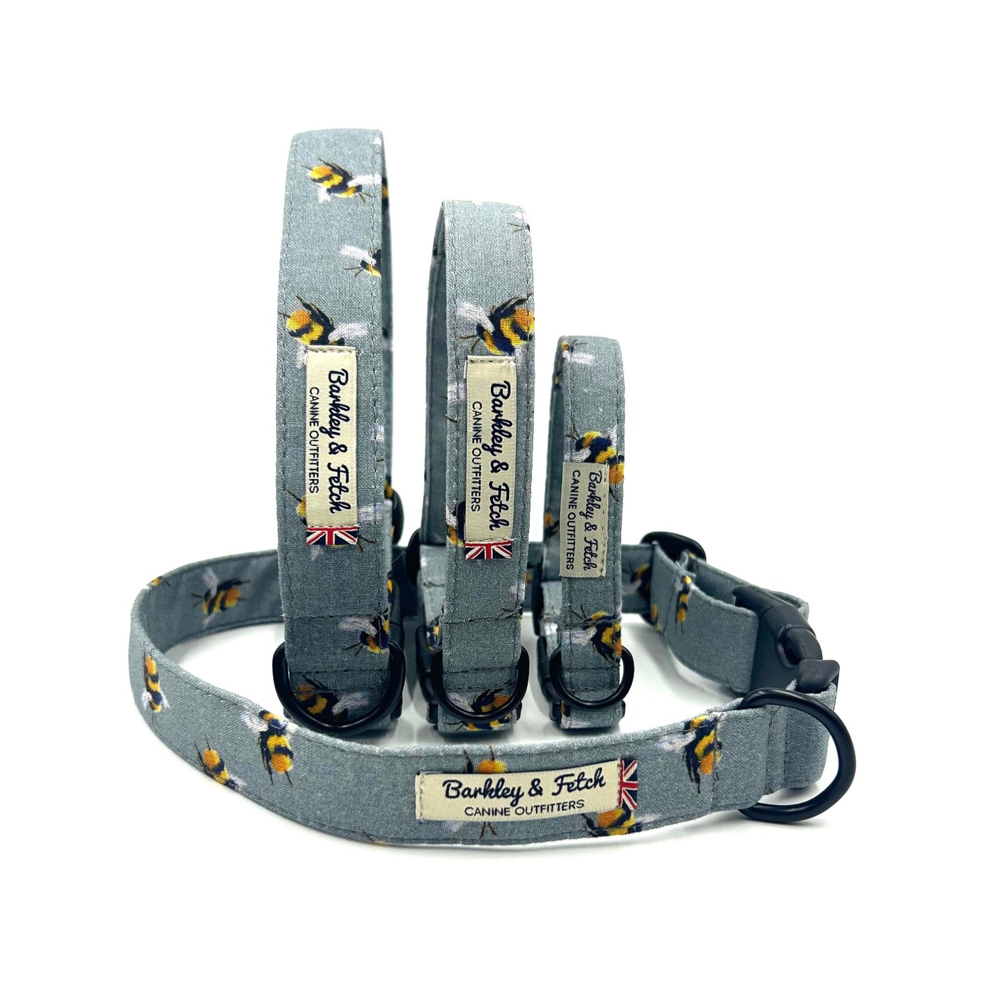 handmadeGrey bee print dog collars showing all sizes on white background