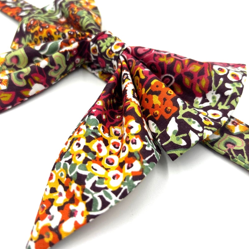 Colorful patterned fabric sailor bow on a white background handmade by barkley and fetch uk
