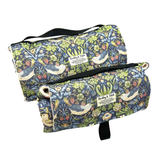 Rolled up settle mats for dogs in a William Morris printed fabric