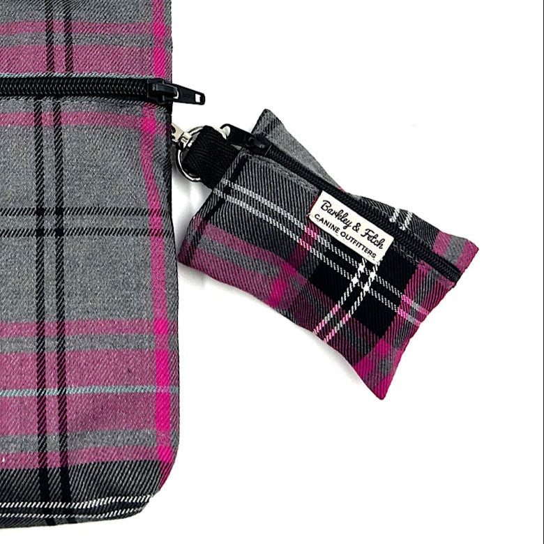 Handmade Pink grey tartan poo bag attached to a larger matching bag on a white background