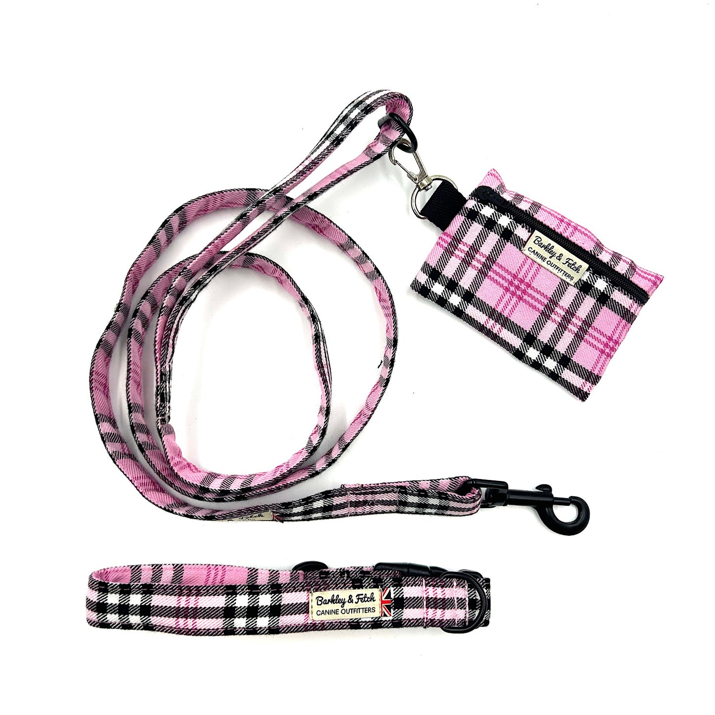 Handmade Pink check dog accessories including lead, collar and poo bag on a white back ground