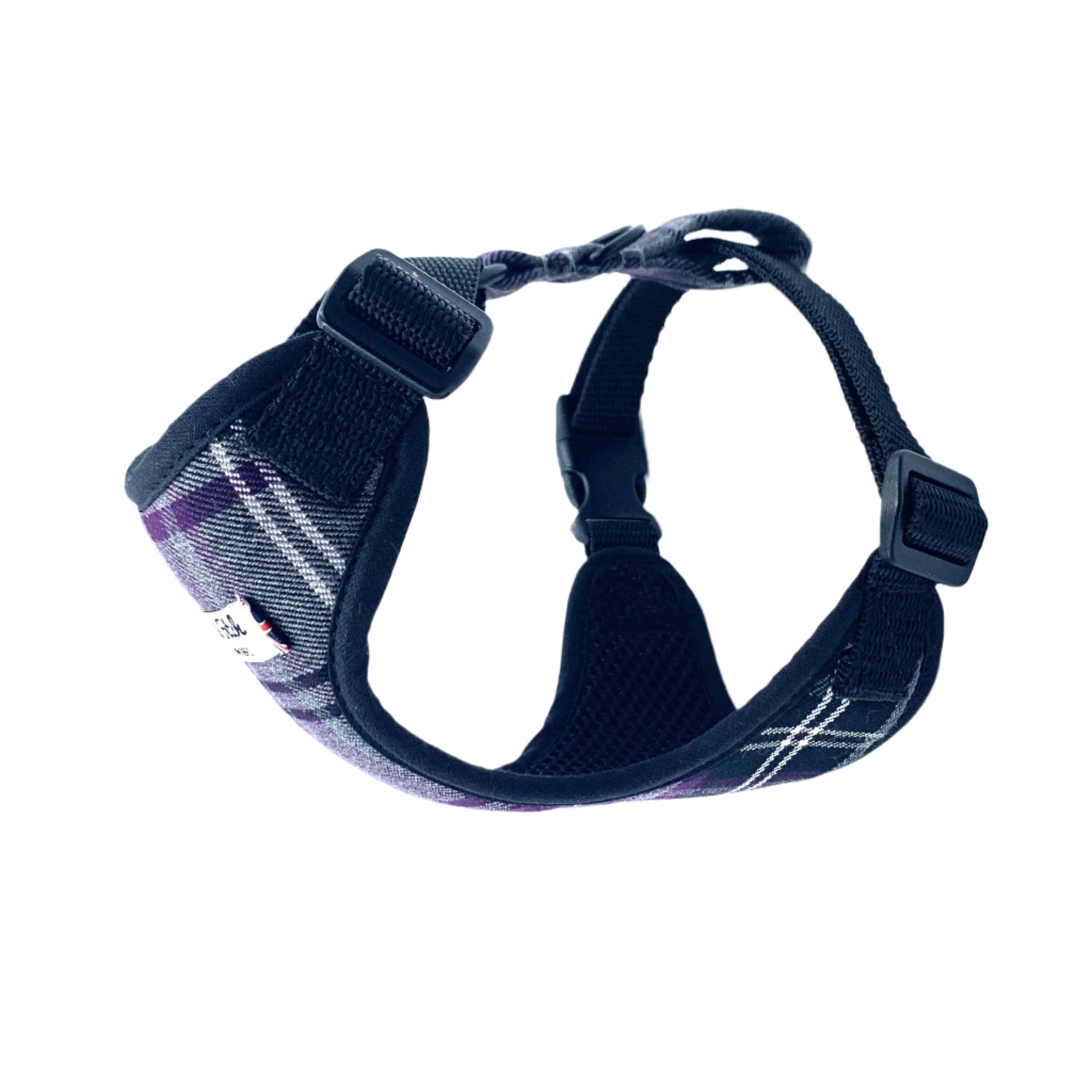 Black dog harness with plaid pattern on a white background