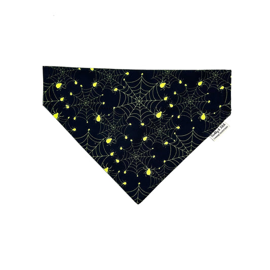 Handmade black and yellow spiderweb print dog bandana that can thread through a collar