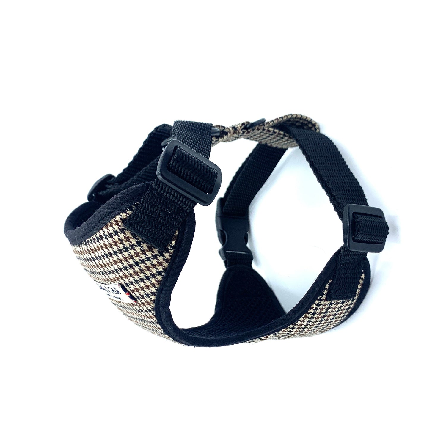 Dog harness with houndstooth pattern on a white background