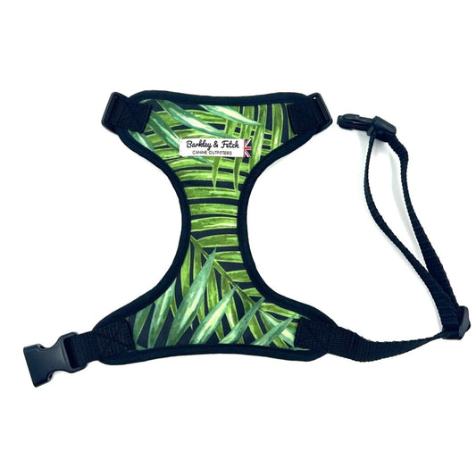 Dog harness with green leaf pattern on a white background