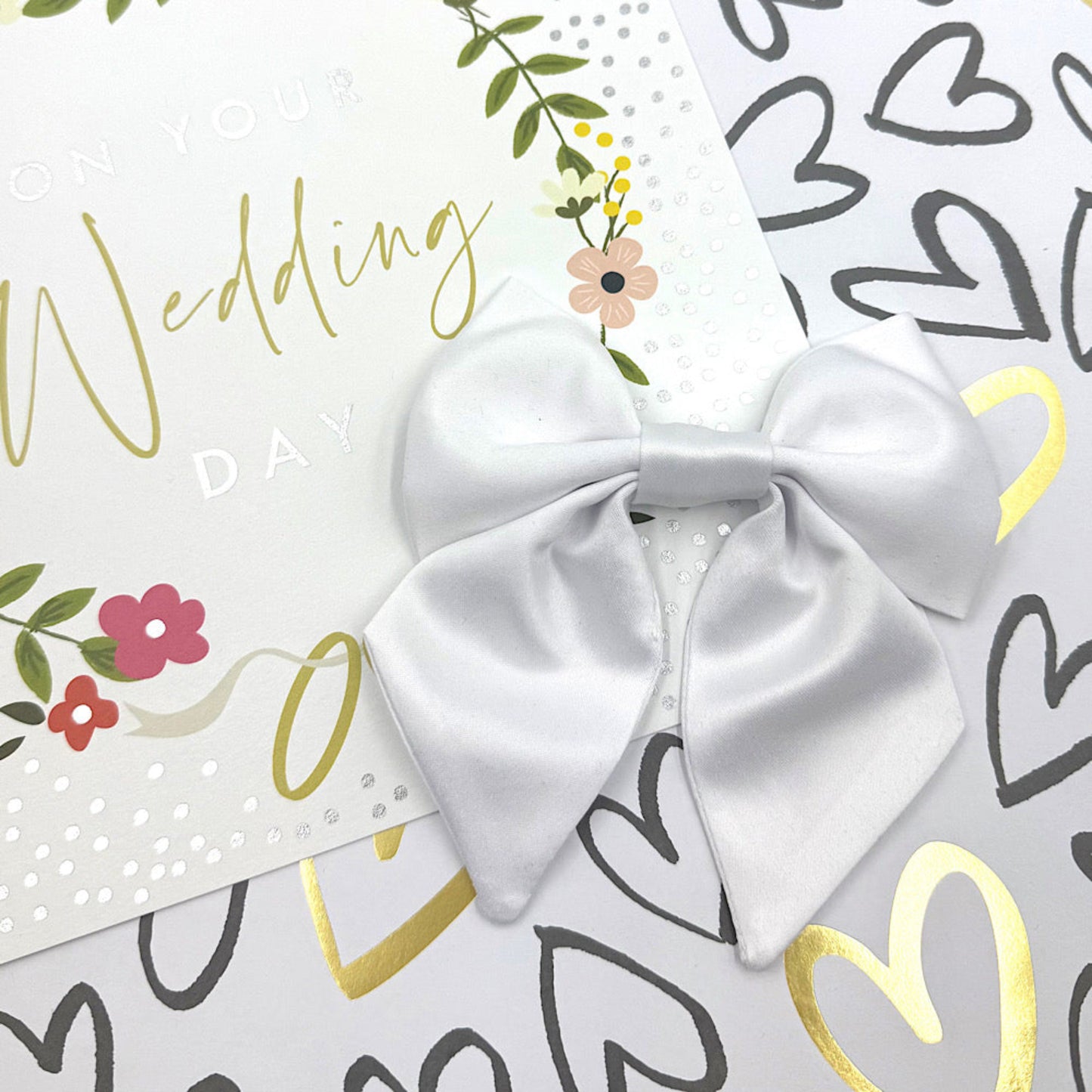 Beautiful handmade white satin dog sailor bow for weddings that can attach to a dog collar