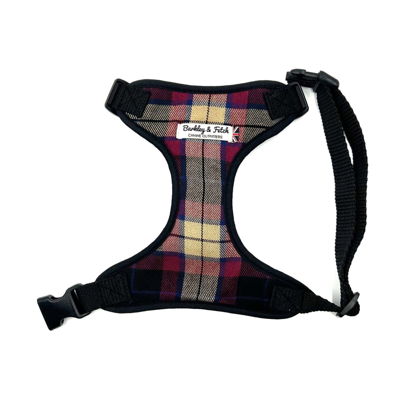 Plaid dog harness with black straps on a white background