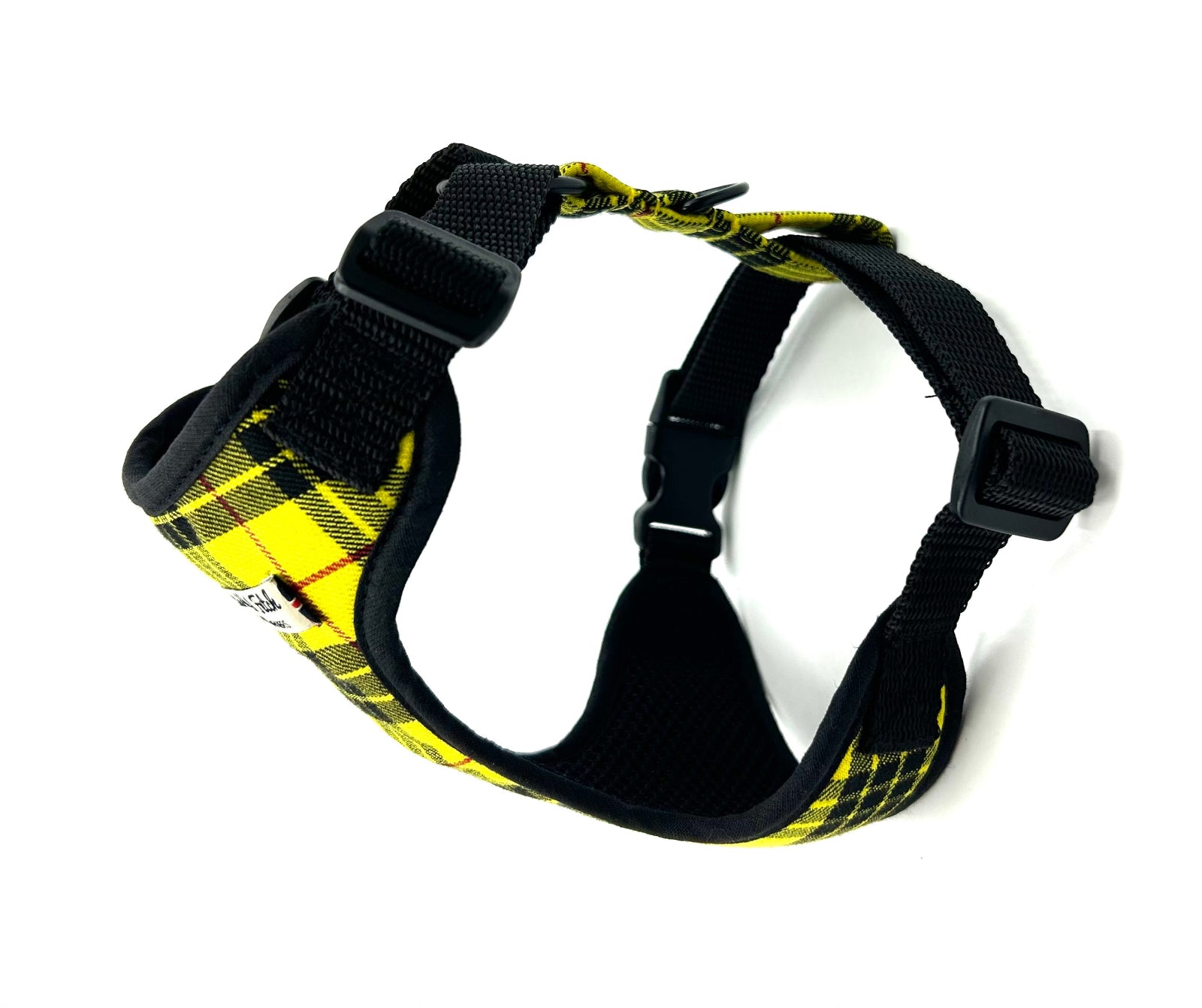 Black and yellow checkered dog harness on a white background