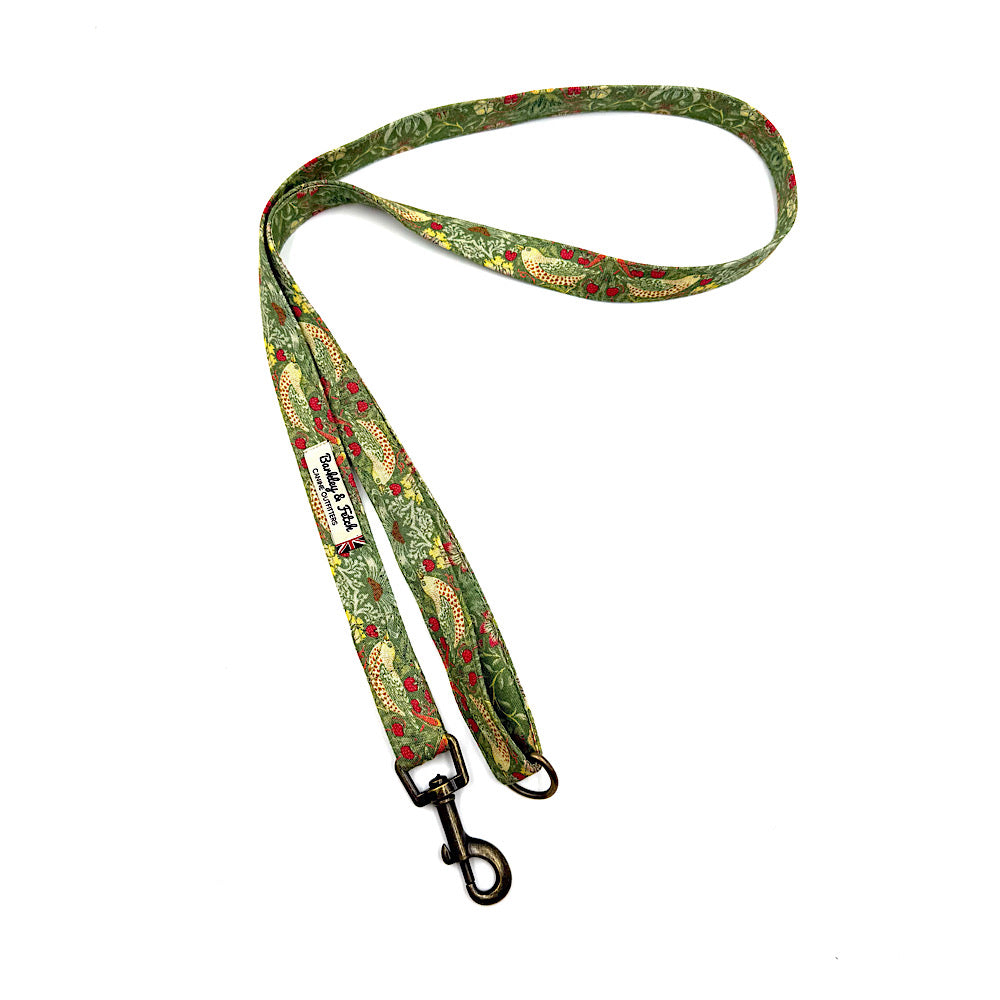 Green patterned dog leash with a metal clip on a white background. Handmade in UK by Barkley and Fetch