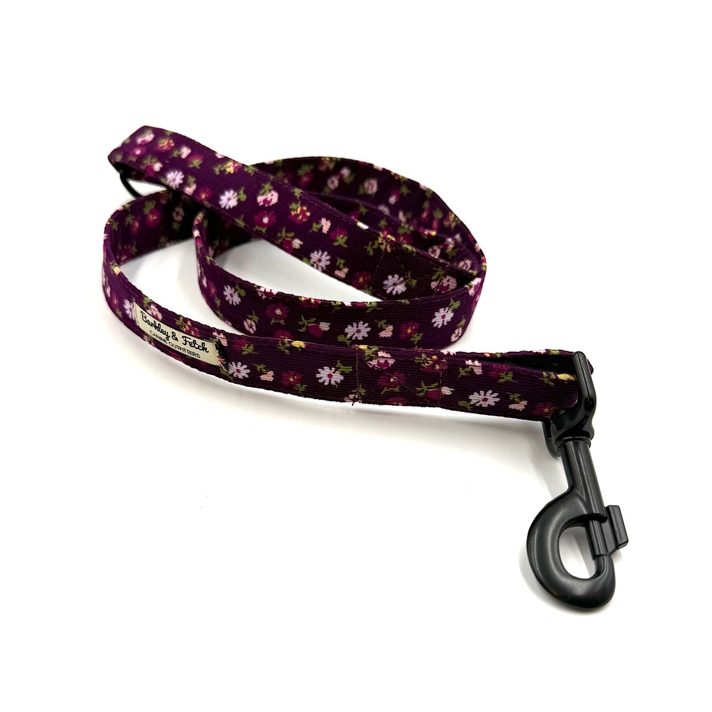 Floral patterned dog leash on a white background