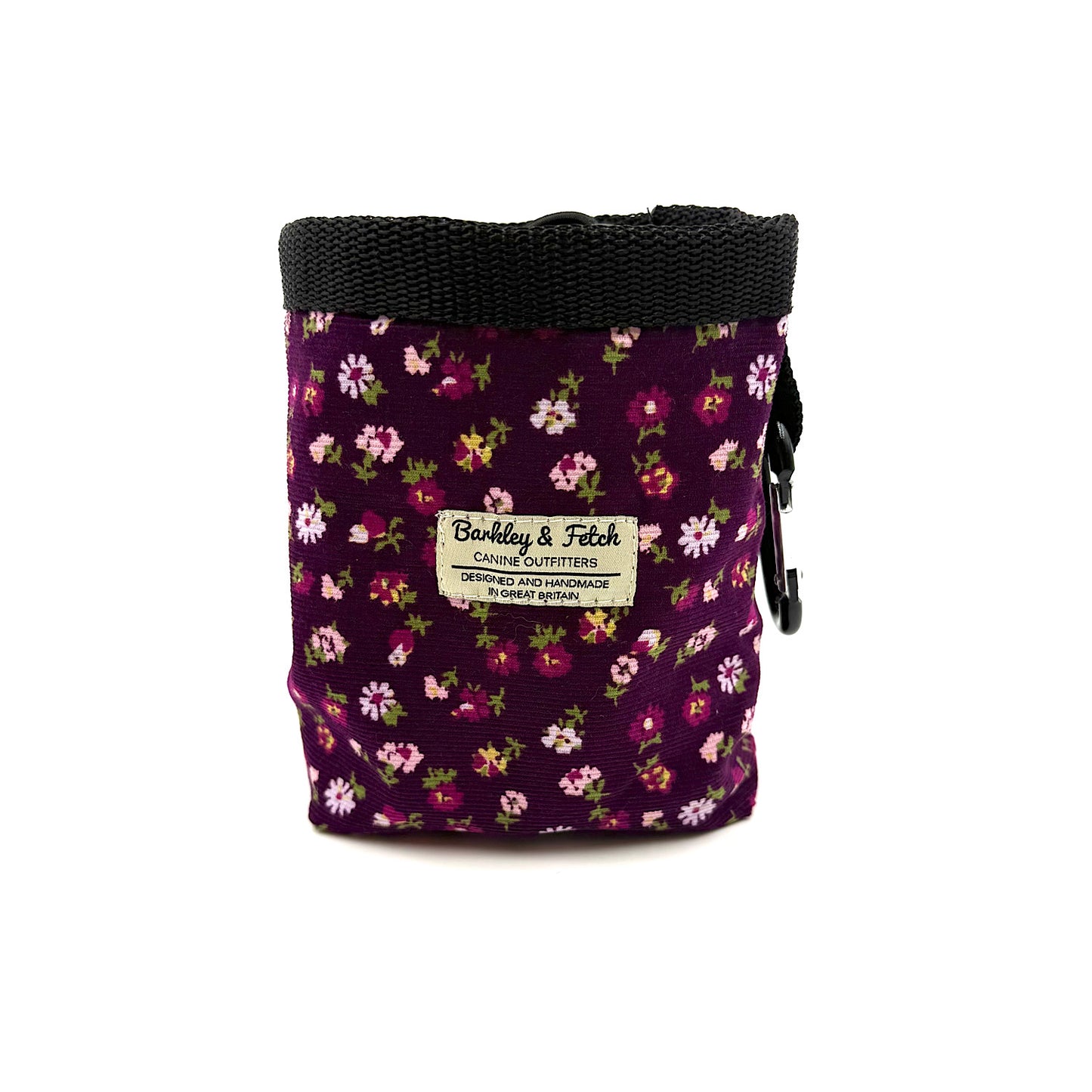 Floral-patterned dog treat bag with a visible Barkley and fetch brand label on a white background