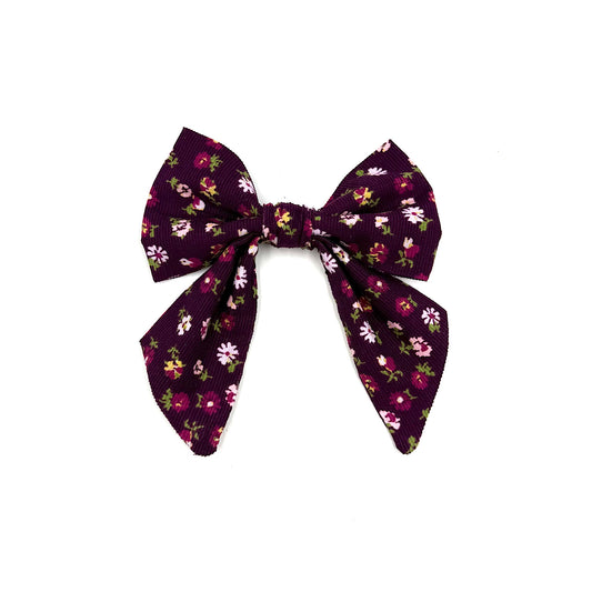 Floral patterned bow on a white background
