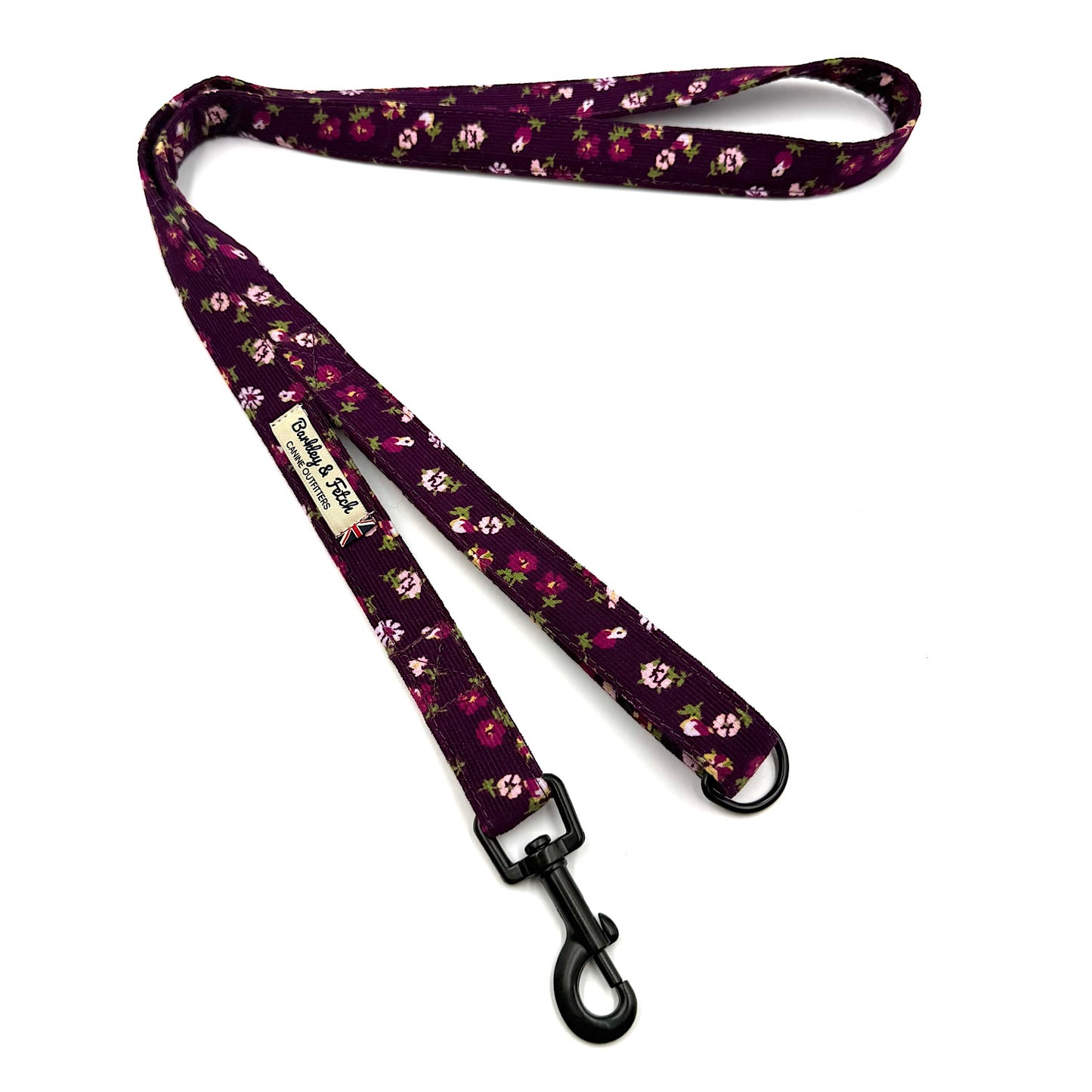 Floral patterned dog leash on a white background
