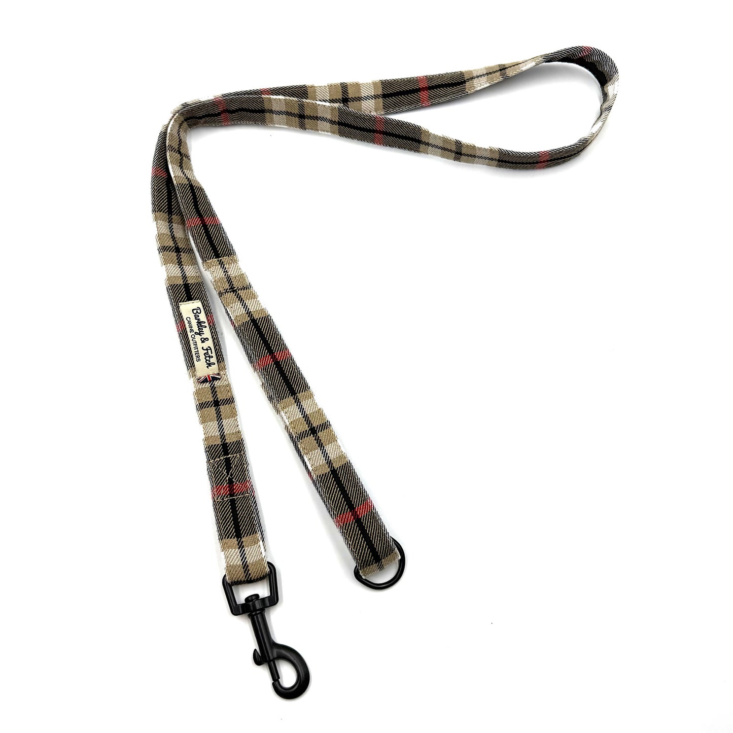 Plaid dog leash with a clip on a white background