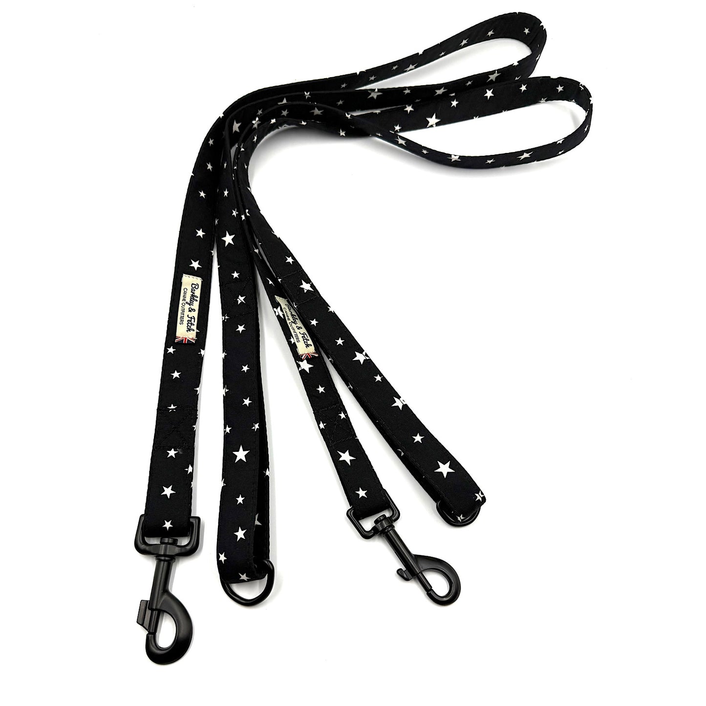 Black dog leash with white star pattern on a white background