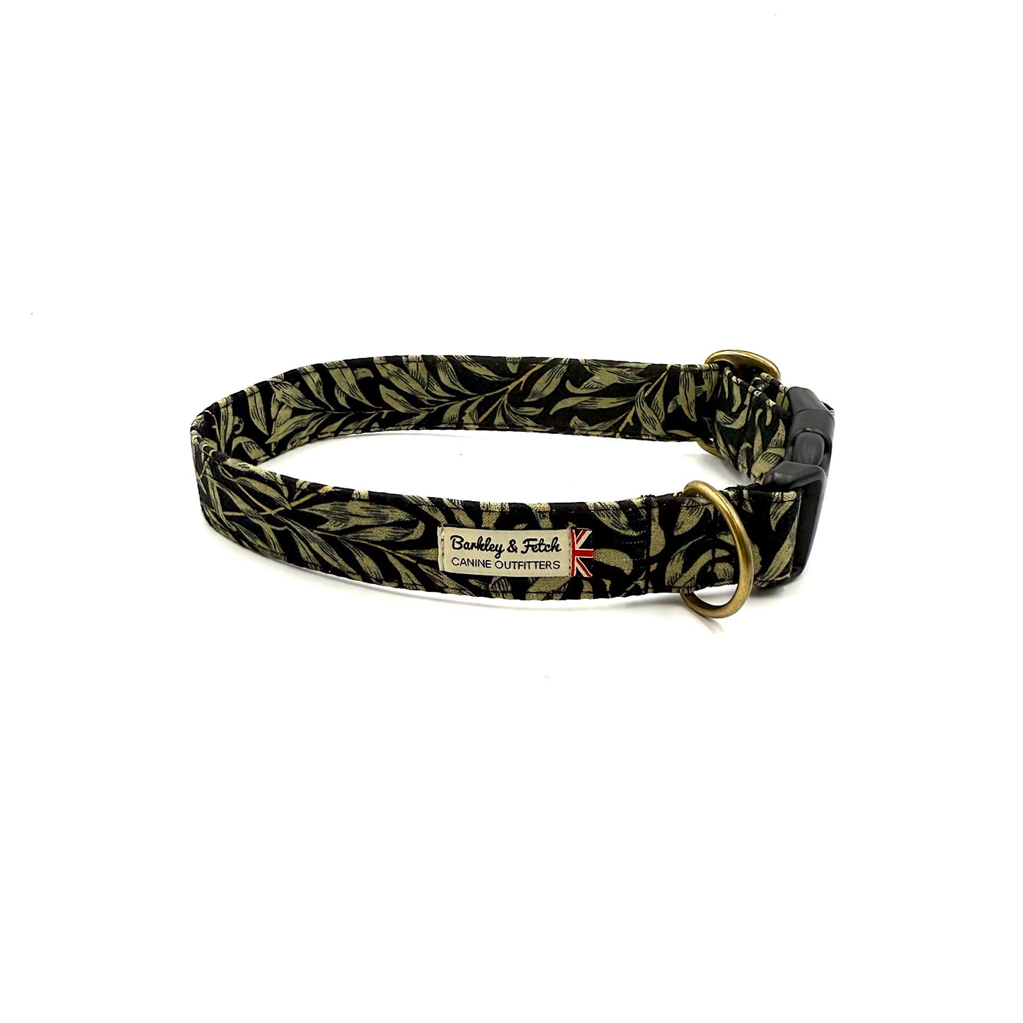 Dog collar with black and gold leaf pattern on a white background
