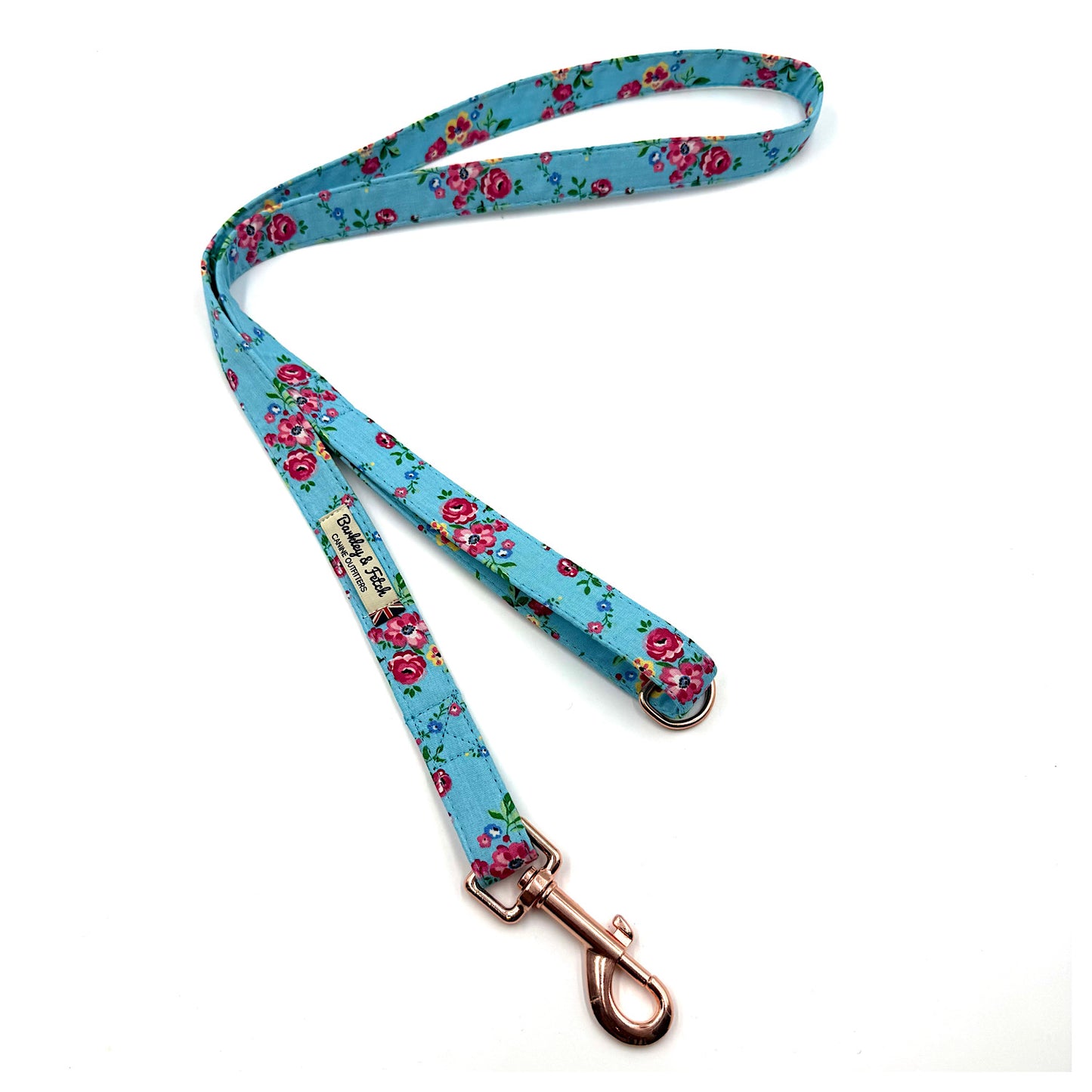 Floral patterned dog leash on a white background