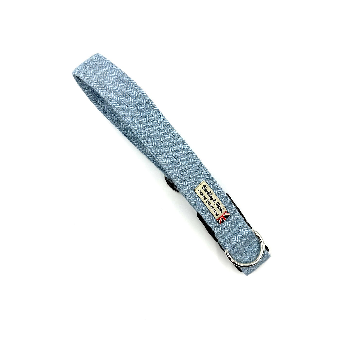 Light blue dog collar with a brand tag on a white background