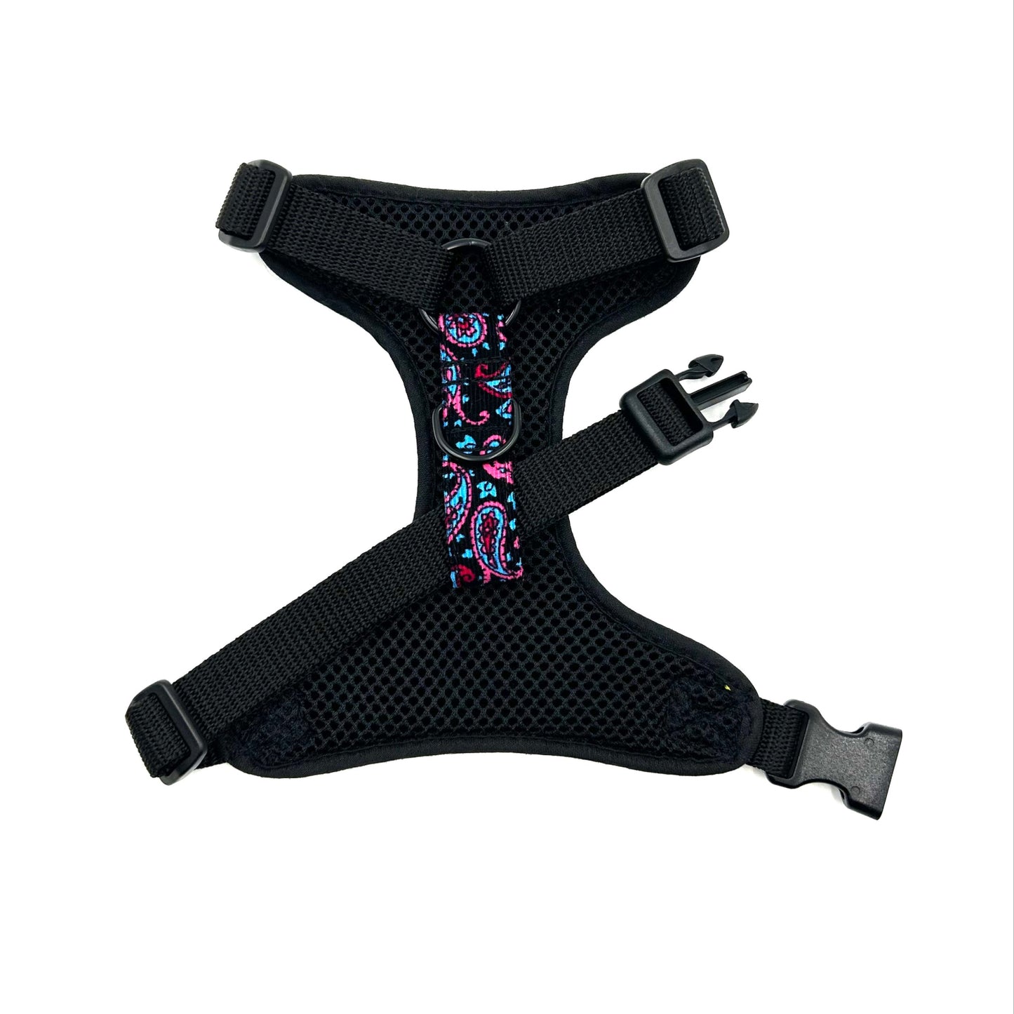 Black dog harness with colorful paisley pattern on a white background