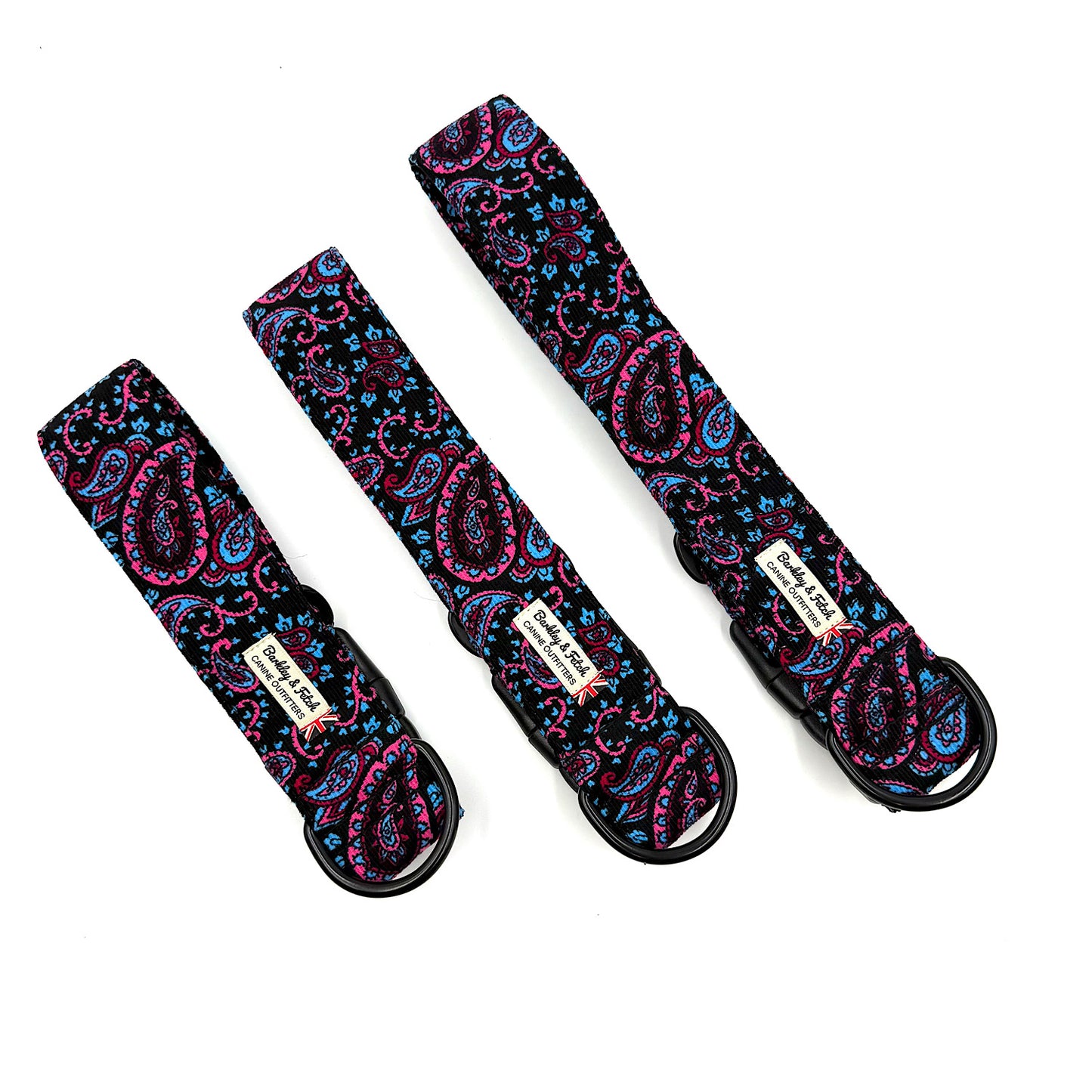 Three paisley-patterned straps with black buckles on a white background