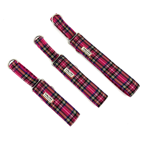 Three tartan-patterned dog collars on a white background