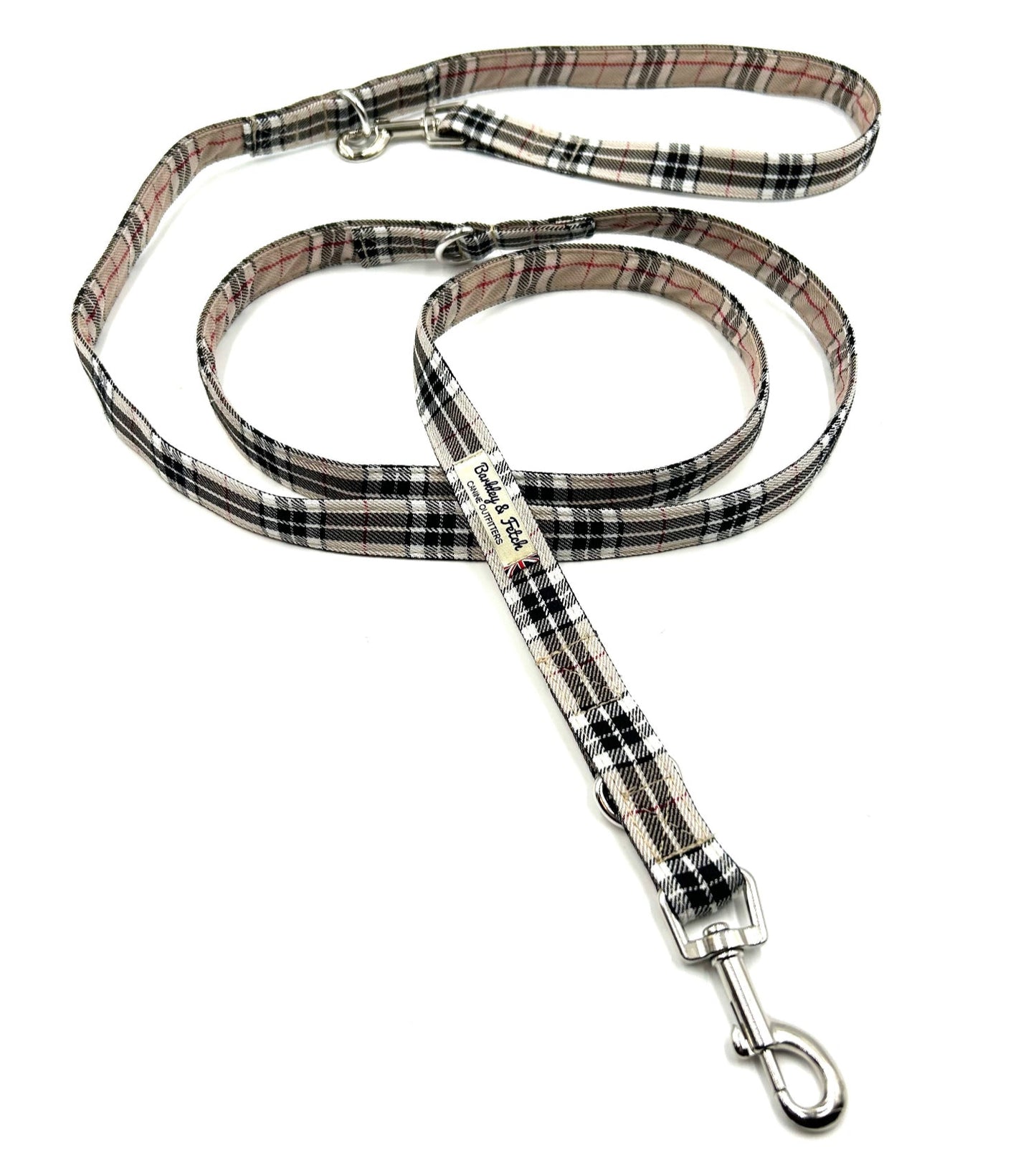 Plaid patterned dog leash on a white background