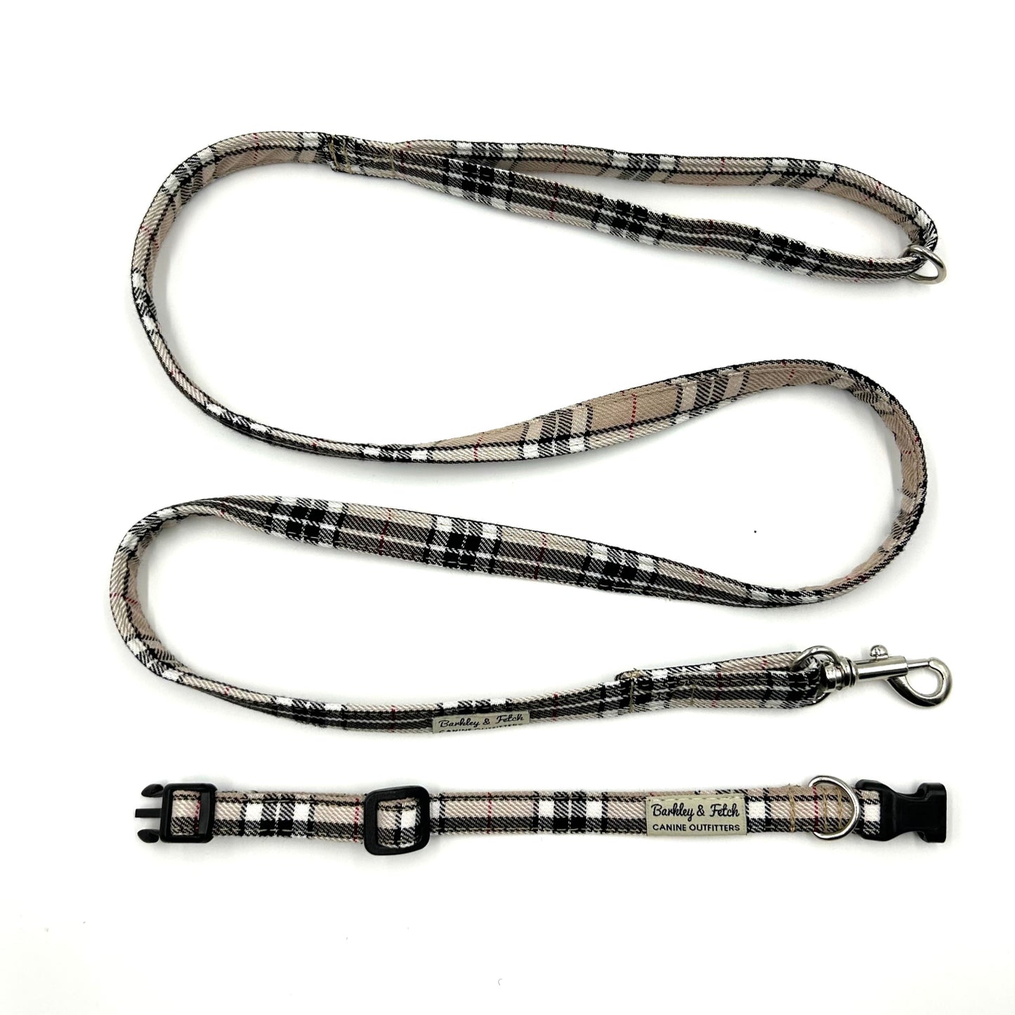 Plaid dog leash with a clip on a white background