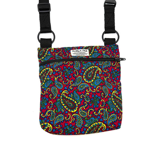 Colorful paisley-patterned bag with black straps on a white backgroundHANDMADE IN UK BY BARKLEY AND FETCH
