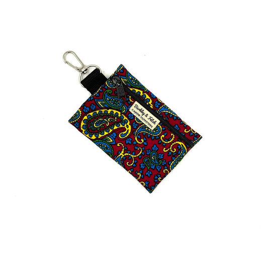 Colorful paisley patterned keychain pouch on a white background