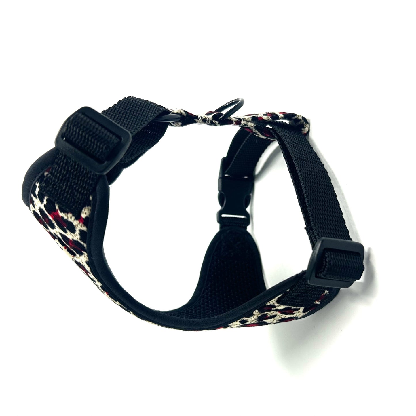 Black dog harness with floral pattern on a white background