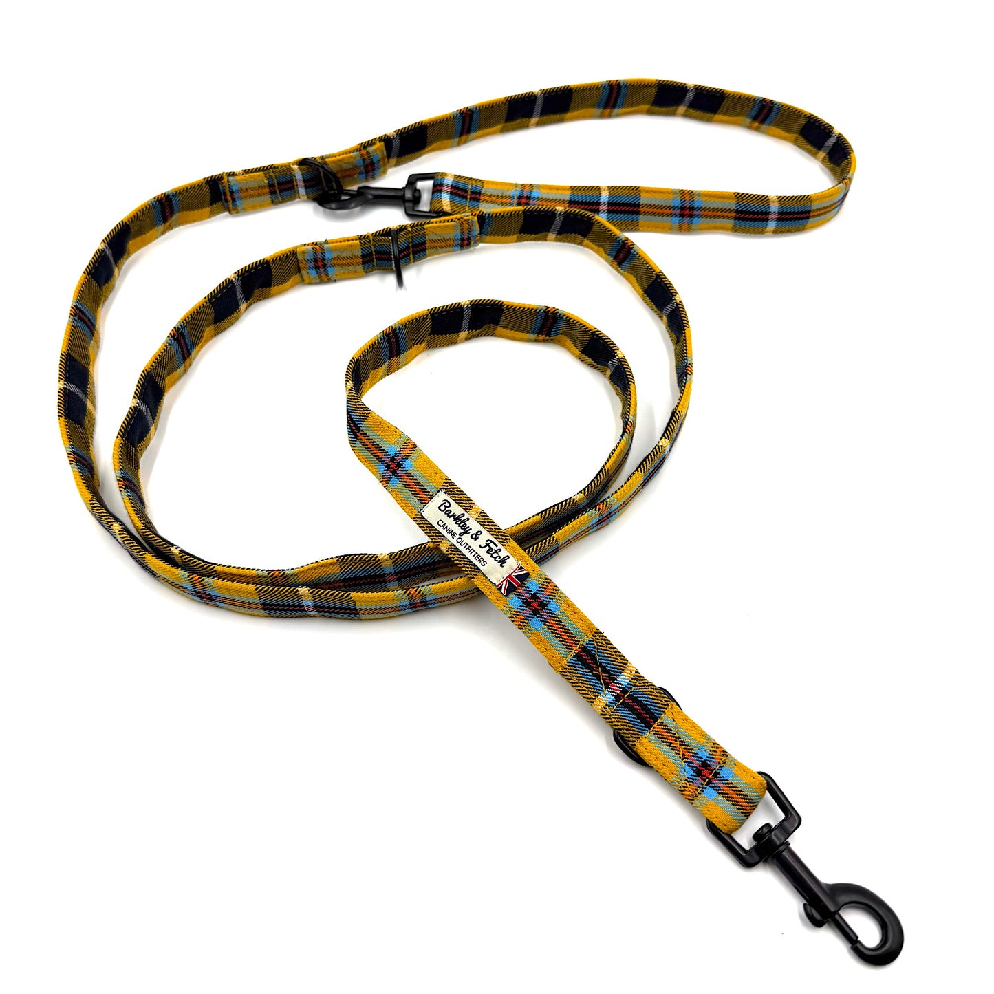 Plaid dog leash with a clip on a white background