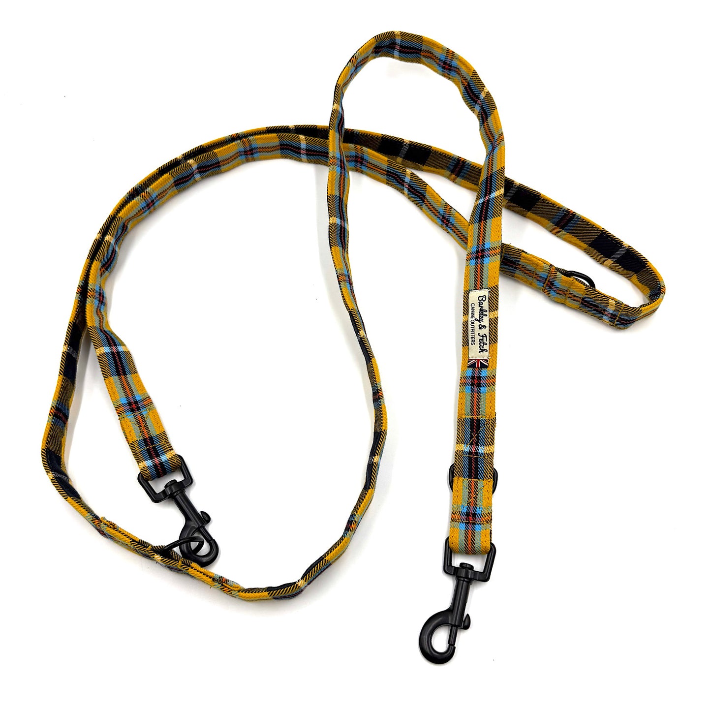 Plaid dog leash with black clip on a white background