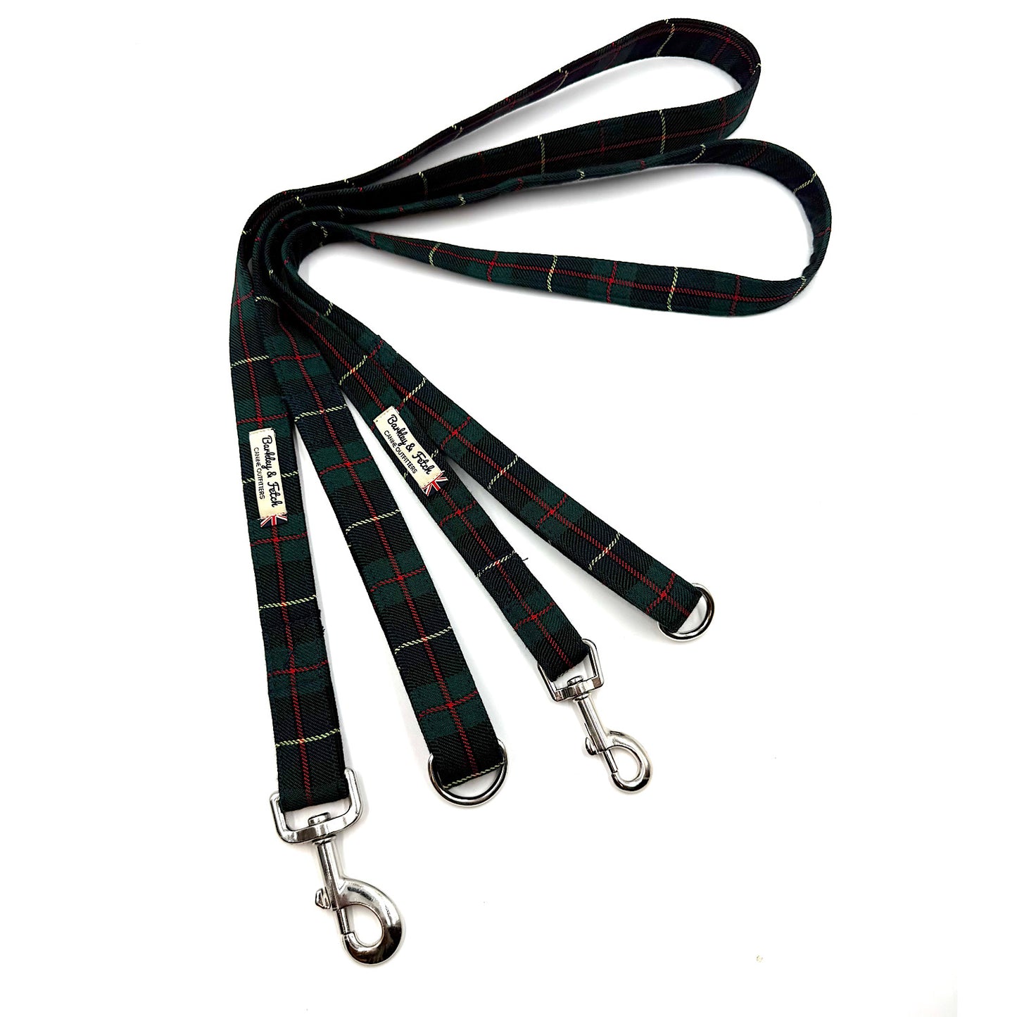 Plaid dog leash with metal clips on a white background