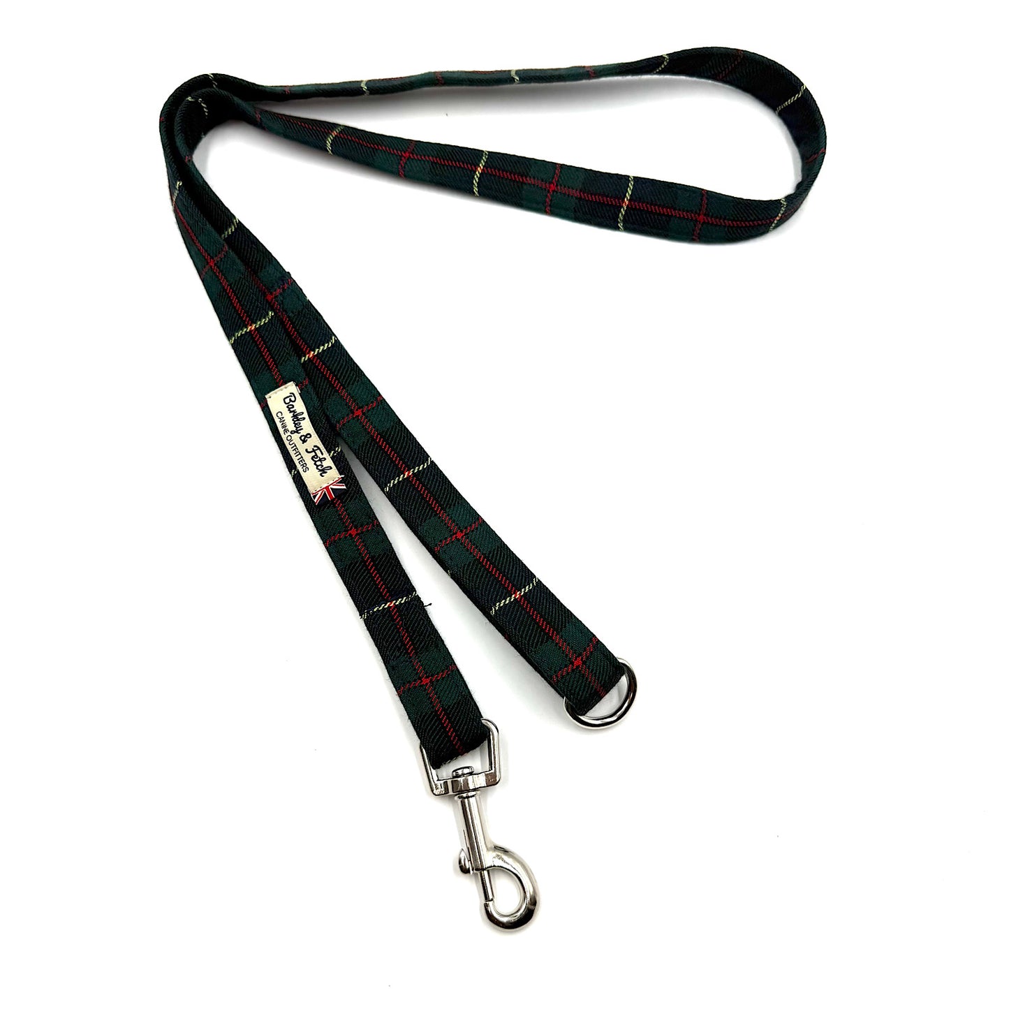 Plaid dog leash with metal clip on a white background