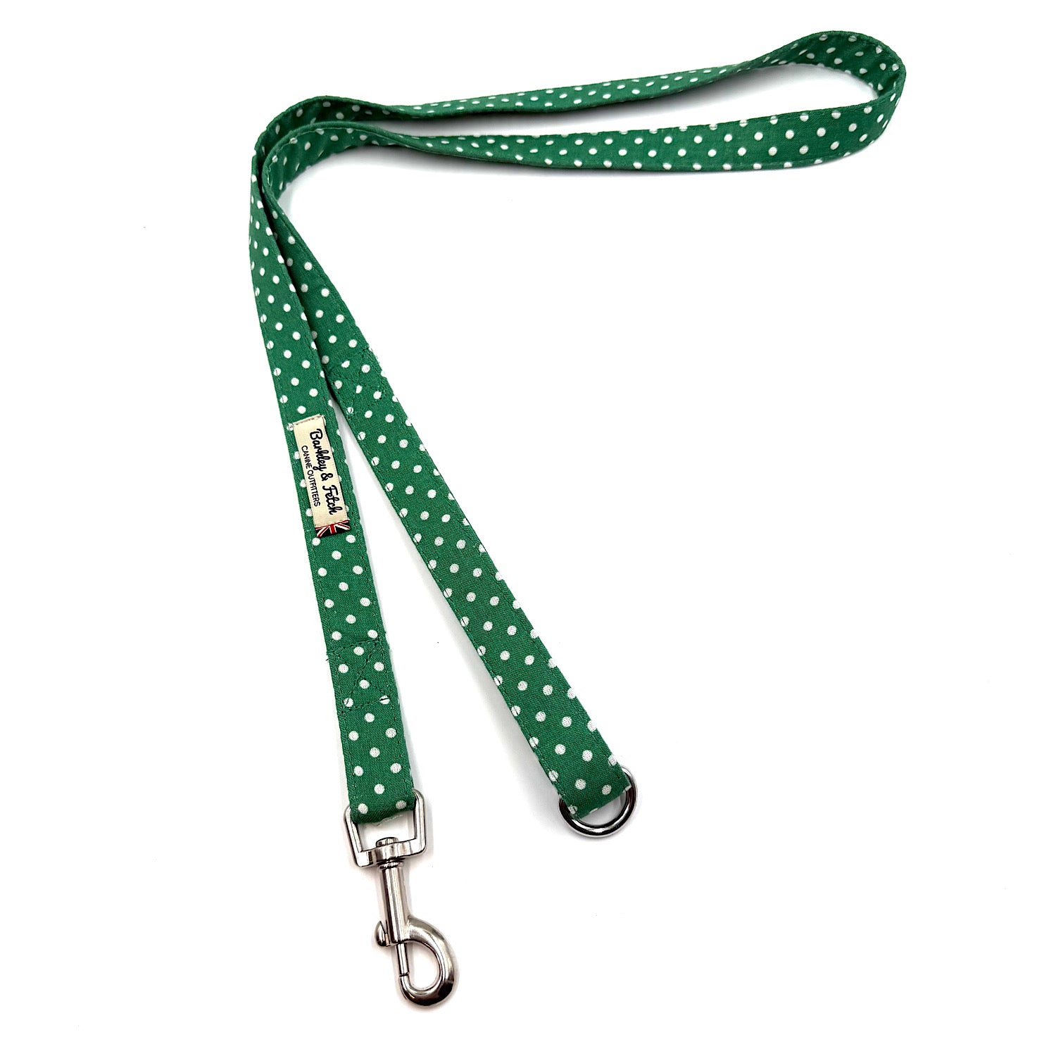 Green polka dot dog leash with a metal clip on a white background