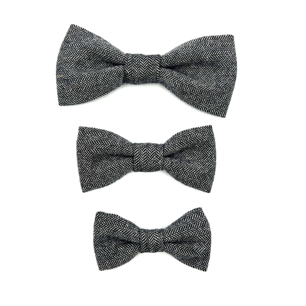 Three black herringbone patterned bow ties on a white background. Handmade in the UK by Barkley and Fetch