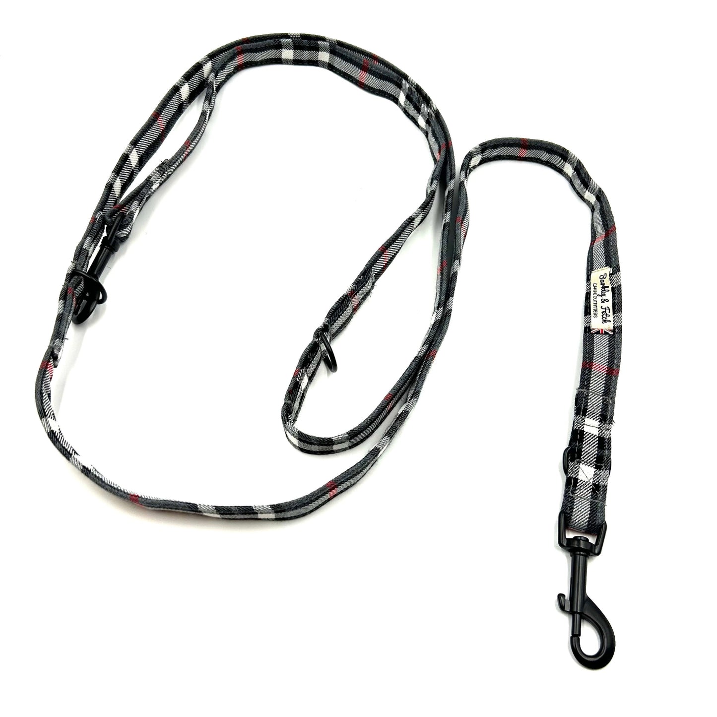 Plaid patterned dog leash on a white background