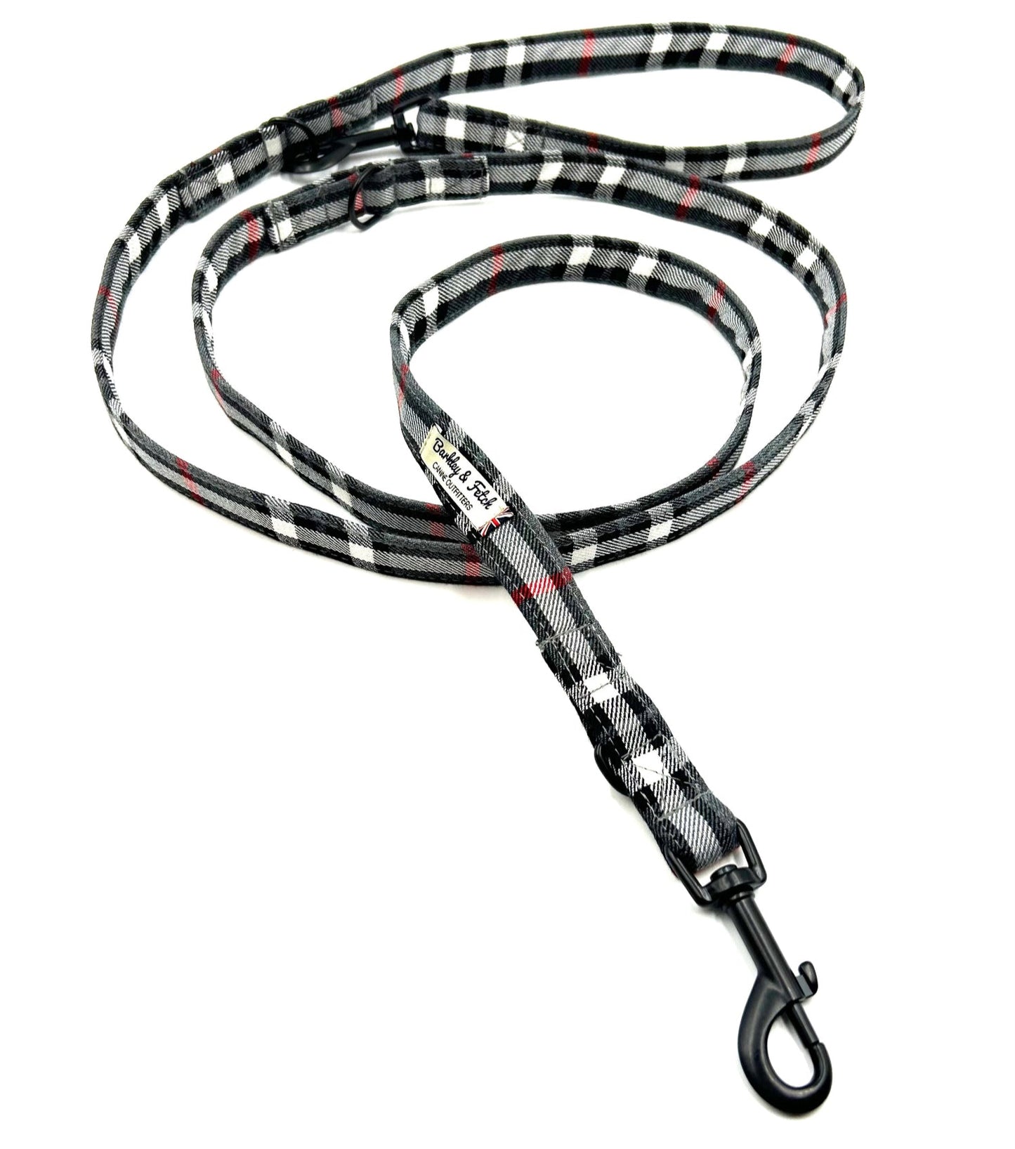Plaid patterned dog leash on a white background