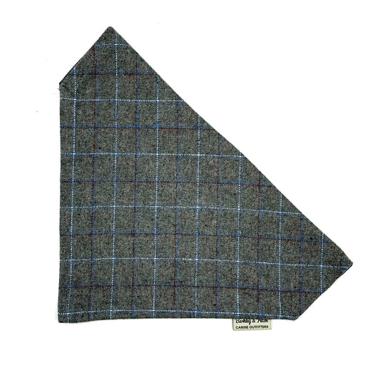 Tweed fabric sample with a check pattern on a white background