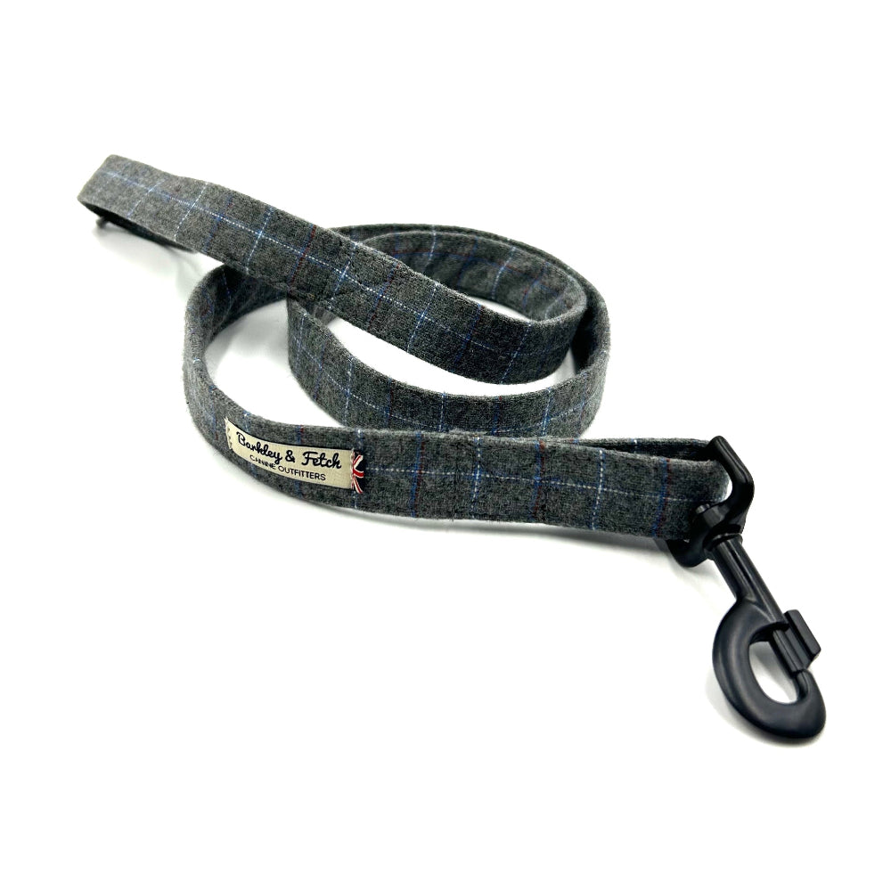 A grey windowpane check dog lead with a heavy duty metal trigger hook and a D-ring on the handle.