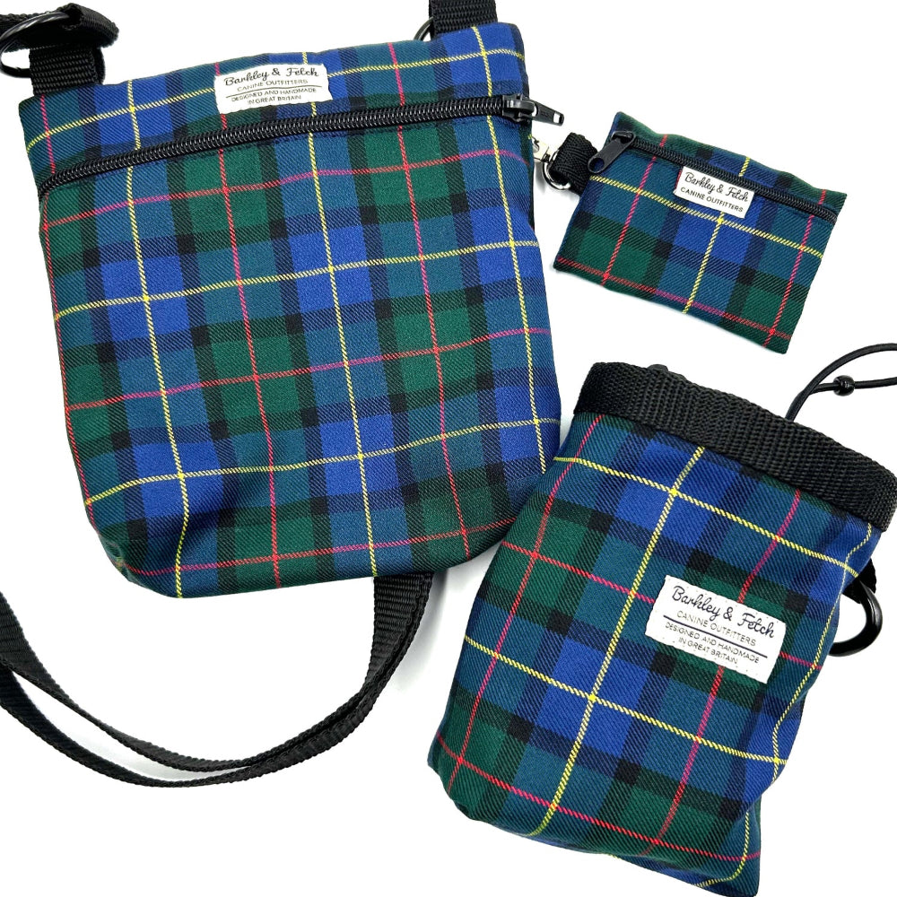 Three plaid bags in blue, green, and red on a white background