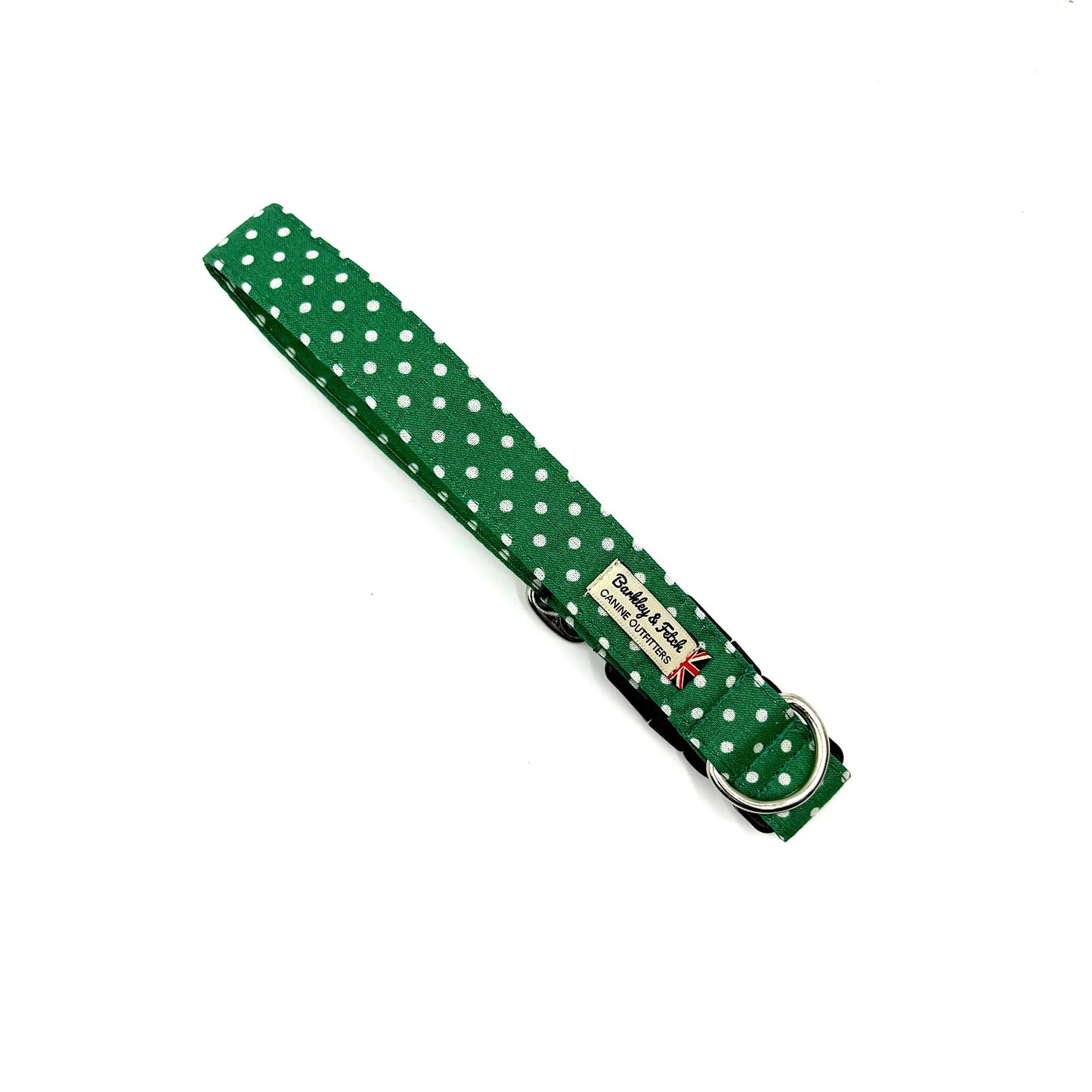 Green polka dot dog collar with a brand label on a white background