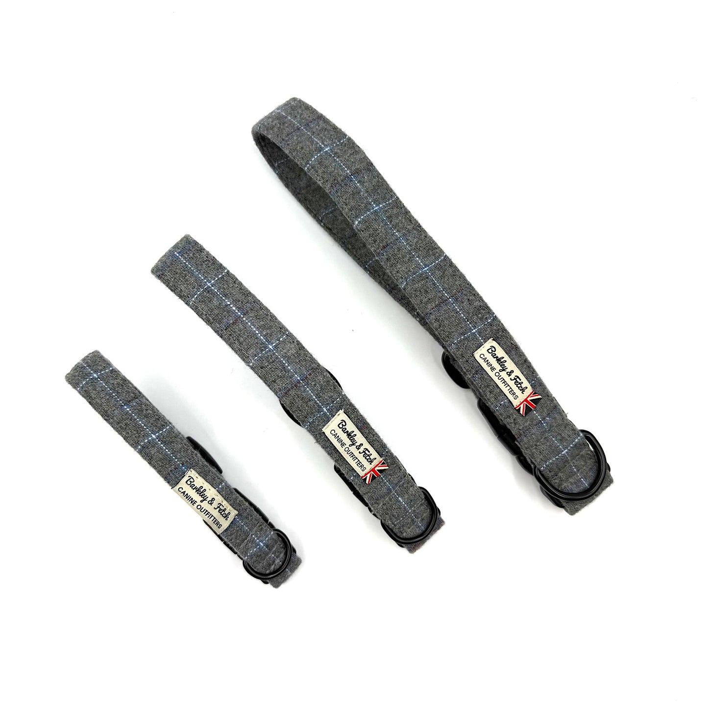 Three gray plaid dog collars with visible branding on a white background
