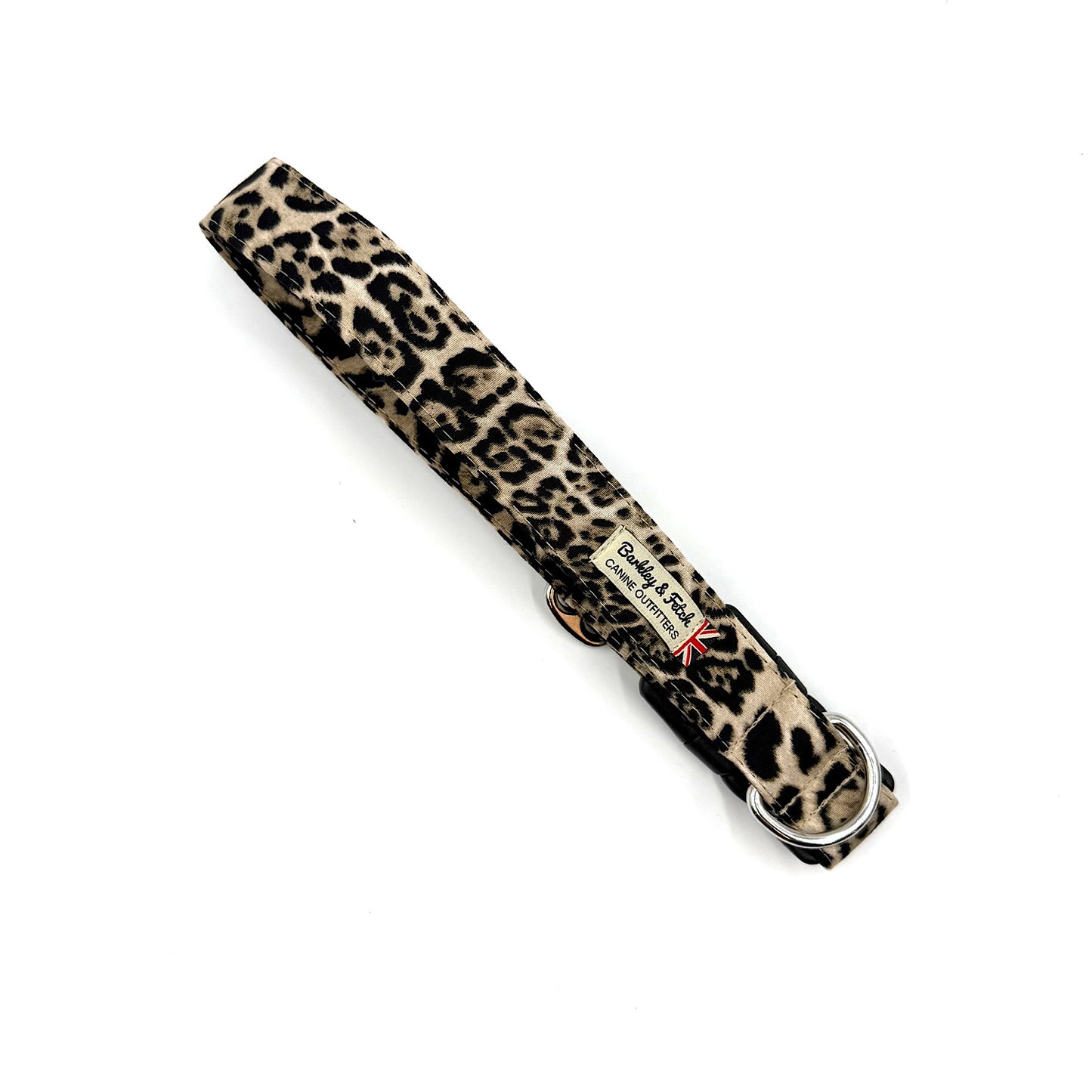 Leopard print dog collar with a brand label on a white background