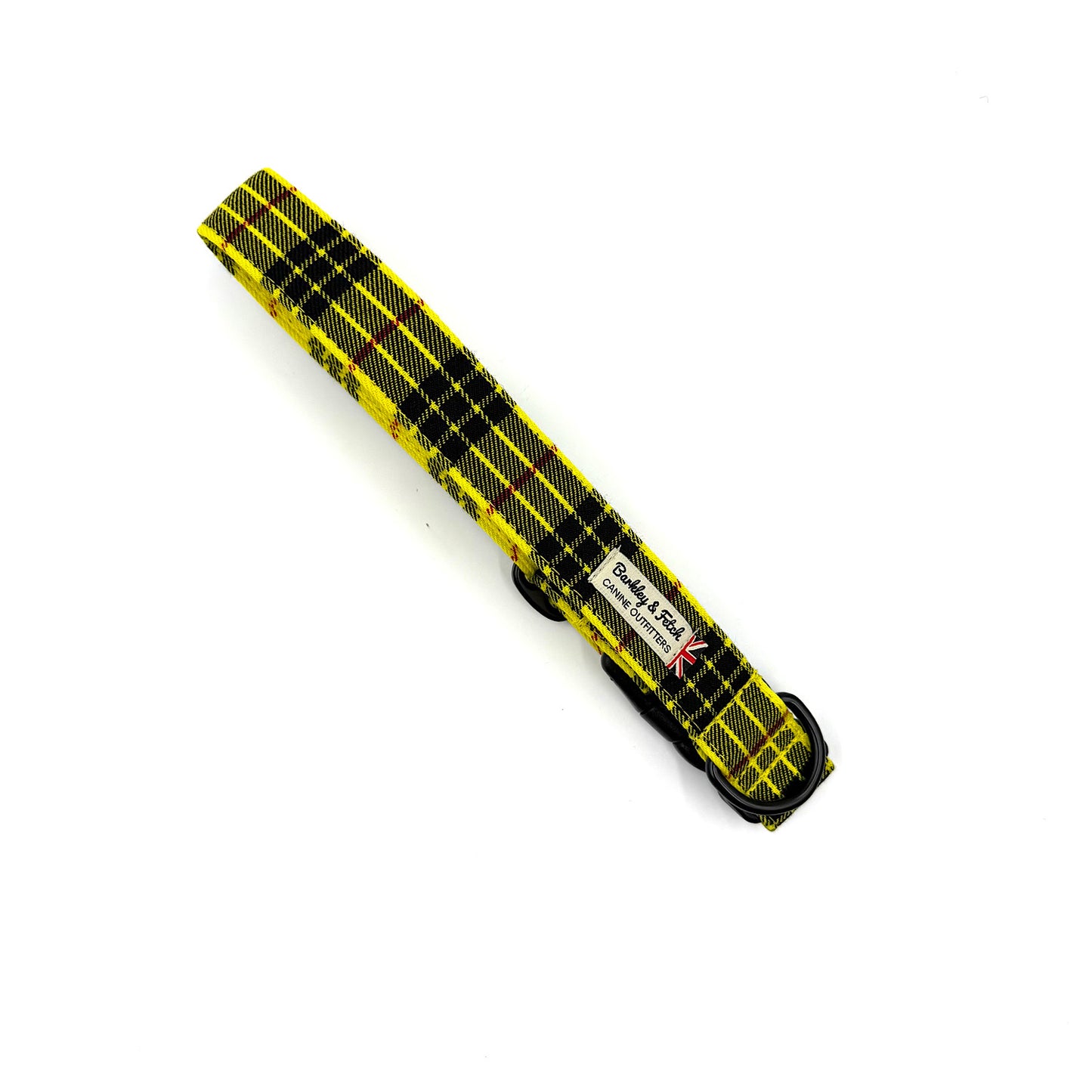 Yellow and black tool with a label on a white background